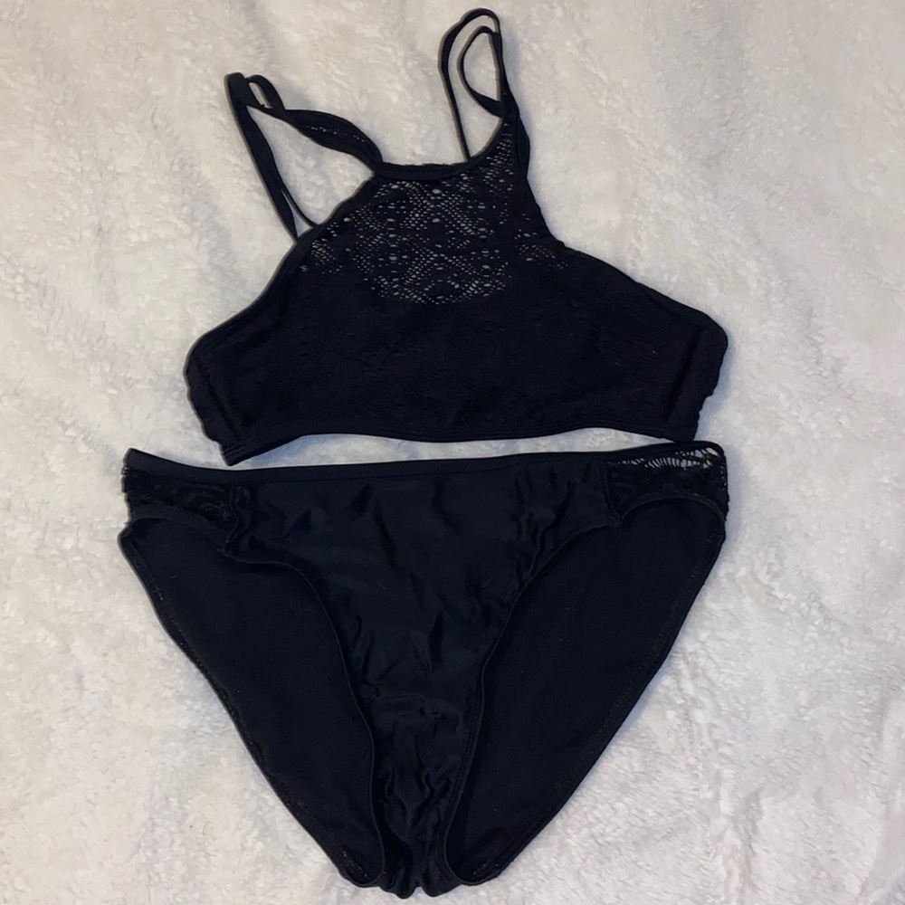 Top is island soul not sure on bottoms, both full black and have “mesh” spots